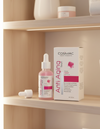 Cosmetic products on a shelf with 'Cosmac' branding